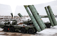 several military vehicles are parked in the snow and one of them has a red sticker that says ' s-300 ' on it