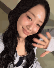 a woman taking a selfie with her hand out