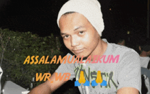 a man wearing a beanie and a t-shirt that says assalamualaikum wrwb