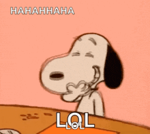 snoopy is laughing while sitting at a table with his mouth open .