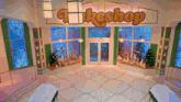 the inside of a cake shop with christmas decorations on the windows
