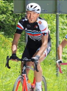 a man riding a bike with a shirt that says nordic marathon