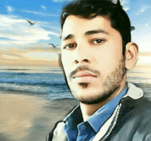 a man with a beard stands on a beach with birds flying in the background