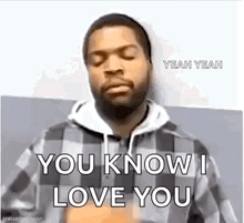 ice cube is wearing a plaid shirt and saying `` you know i love you '' .
