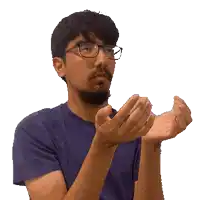 a man wearing glasses is clapping his hands
