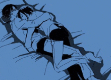 a man and a woman are hugging each other while laying on a bed .