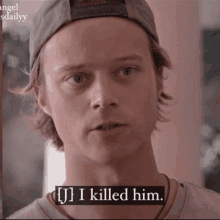 a close up of a man wearing a baseball cap and a t-shirt that says `` i killed him '' .