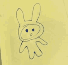 a child 's drawing of a rabbit on a piece of paper .