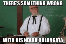 a man with glasses and suspenders says there 's something wrong with his nduia oblongata in front of a blackboard