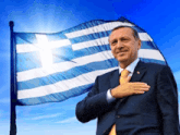 a man in a suit with his hand on his chest in front of a greek flag