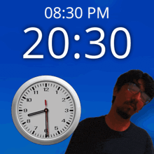 a man is standing in front of a clock that says 20:30 pm