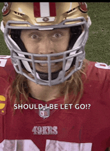 a football player wearing a 49ers jersey and helmet