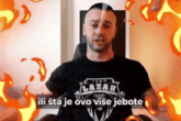 a man wearing a black t-shirt that says team lazar
