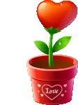 a heart shaped flower is growing out of a red pot with the word love on it .