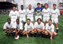 a group of soccer players are posing for a photo and one of them is wearing an admiral jersey