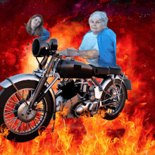 a woman in a blue jacket is riding a motorcycle in a fire