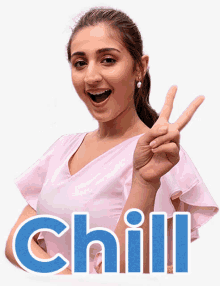 a woman in a pink shirt giving a peace sign with the word chill behind her