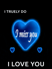 a blue heart with the words i miss you on it