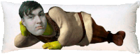 shrek is laying on a pillow with his head resting on his hands