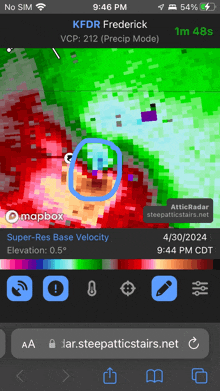 a cell phone screen shows a map of kfdr frederick with a blue circle around it