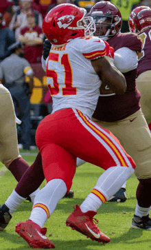 a football player with the number 21 on their helmet