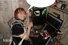 a woman is sitting at a desk with a speech bubble that says fotor