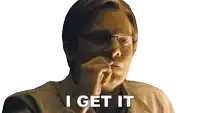 a man with glasses says i get it with his hand on his chin