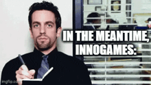 a man is writing in a notebook with the words in the meantime innogames