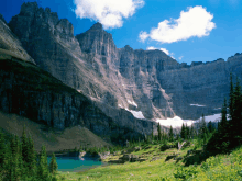 a mountain with a lake in the foreground