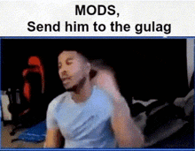 a man in a blue shirt is sitting in front of a screen that says mods send him to the gulag ..