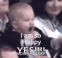 a baby is being held by a woman and says `` i am so happy yes ! now let 's go ! ''