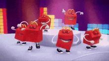 a group of mcdonald 's happy meals are dancing on a stage