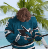 a man in a sharks jersey with the number 2 on it