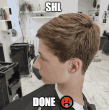 a picture of a boy getting a haircut with shl done written on it