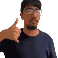 a man wearing glasses giving a thumbs up sign