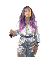 a woman with purple hair is wearing a silver outfit