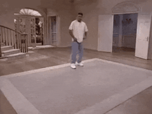 a man is riding a skateboard on a rug in a room .