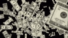 a bunch of dollar bills are falling from the sky on a black background .