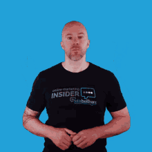 a man wearing a black shirt that says insider