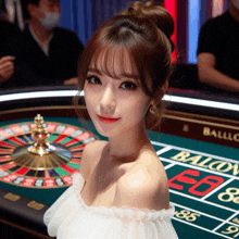 a woman stands in front of a roulette table that says balcony on it