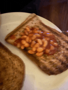 a slice of toast with baked beans on it