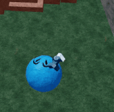 a blue ball with a face drawn on it in a video game