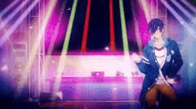 a man is dancing on a stage in front of a purple and green light .