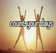 a picture of two people jumping in the air with the words count your days below them