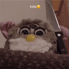 a stuffed animal holding a knife with a smiley face on it and the word hiiiiii above it