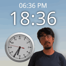 a man is standing in front of a clock that says 18:36