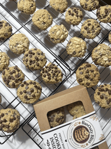 a box of banbury bisc cookies sits on a cooling rack