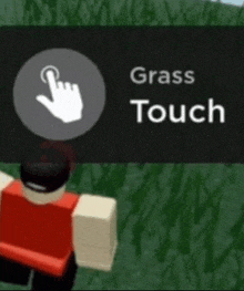 a person in a red shirt is standing in the grass and pressing a button that says `` grass touch '' .