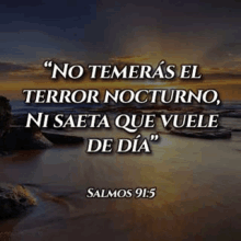 a bible verse in spanish with a picture of a beach and a sunset .