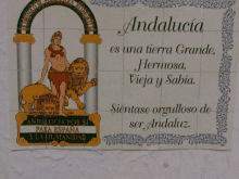 a sign that says andalucia on it in spanish